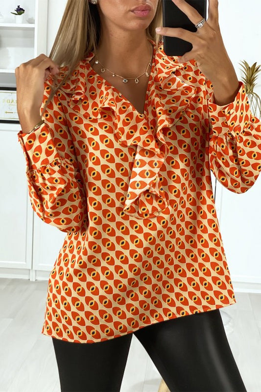 Blouse à motif orange avec volant à l'avant