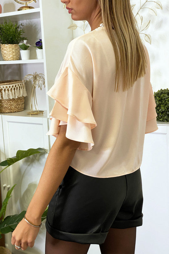 Blouse rose en crêpe avec volants aux manches